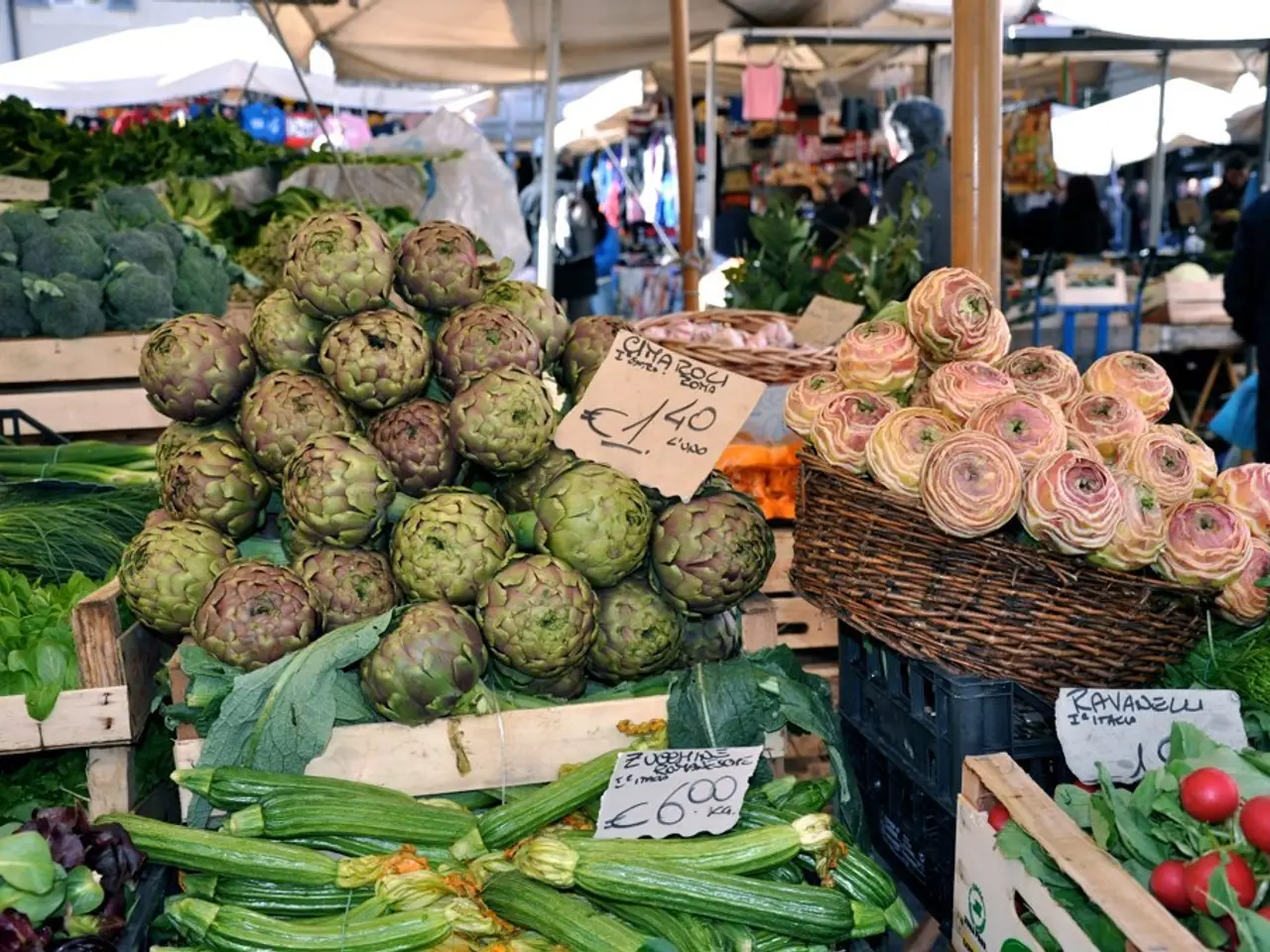 In this image there are baskets. There are fruits and vegetables in the baskets. There are small...