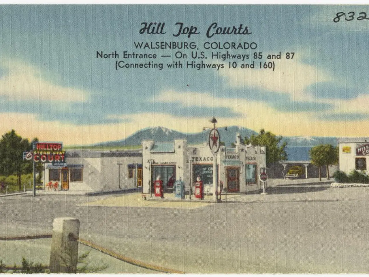 In the center of the image we can see buildings and trees. At the bottom there is fence. In the...