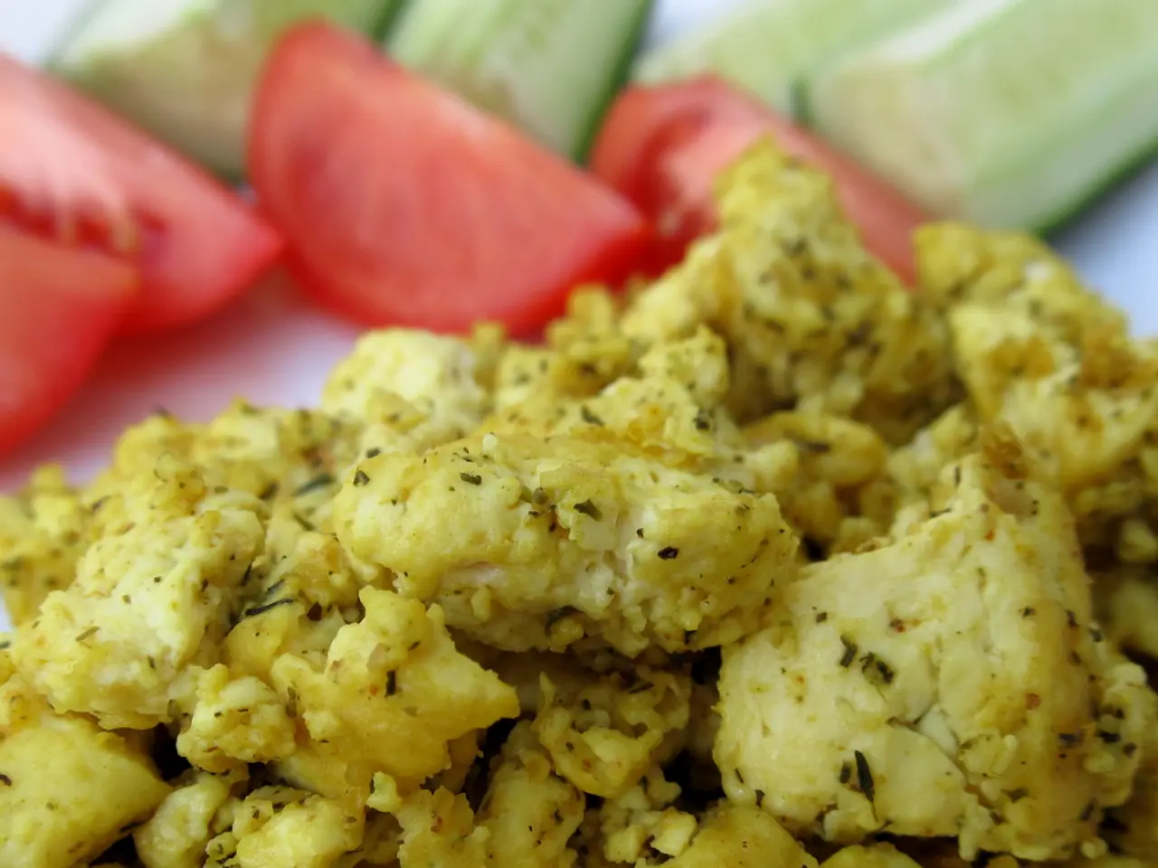 In the foreground of this image, there is some food item on the white surface and at the top, there...