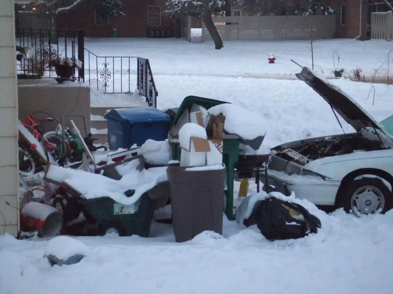 This image is clicked outside. There is trash in the middle. There is a car on the right side....