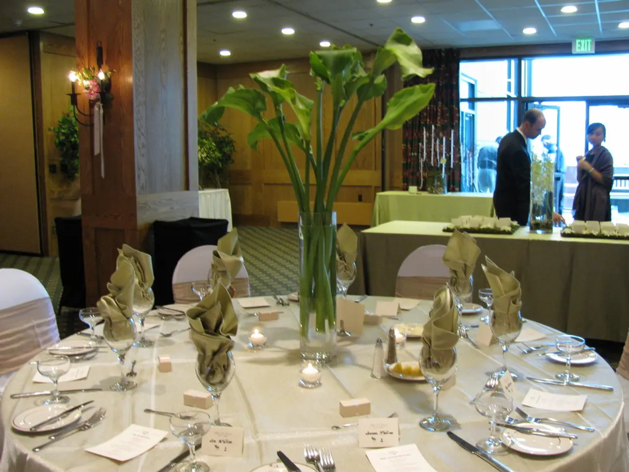 This picture is clicked inside the hotel and in front, we see a table on which white color cloth is...