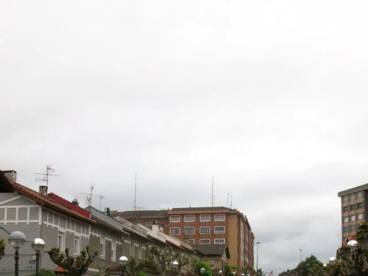 This is the picture of a city. In this picture there are group of people holding the banners and...