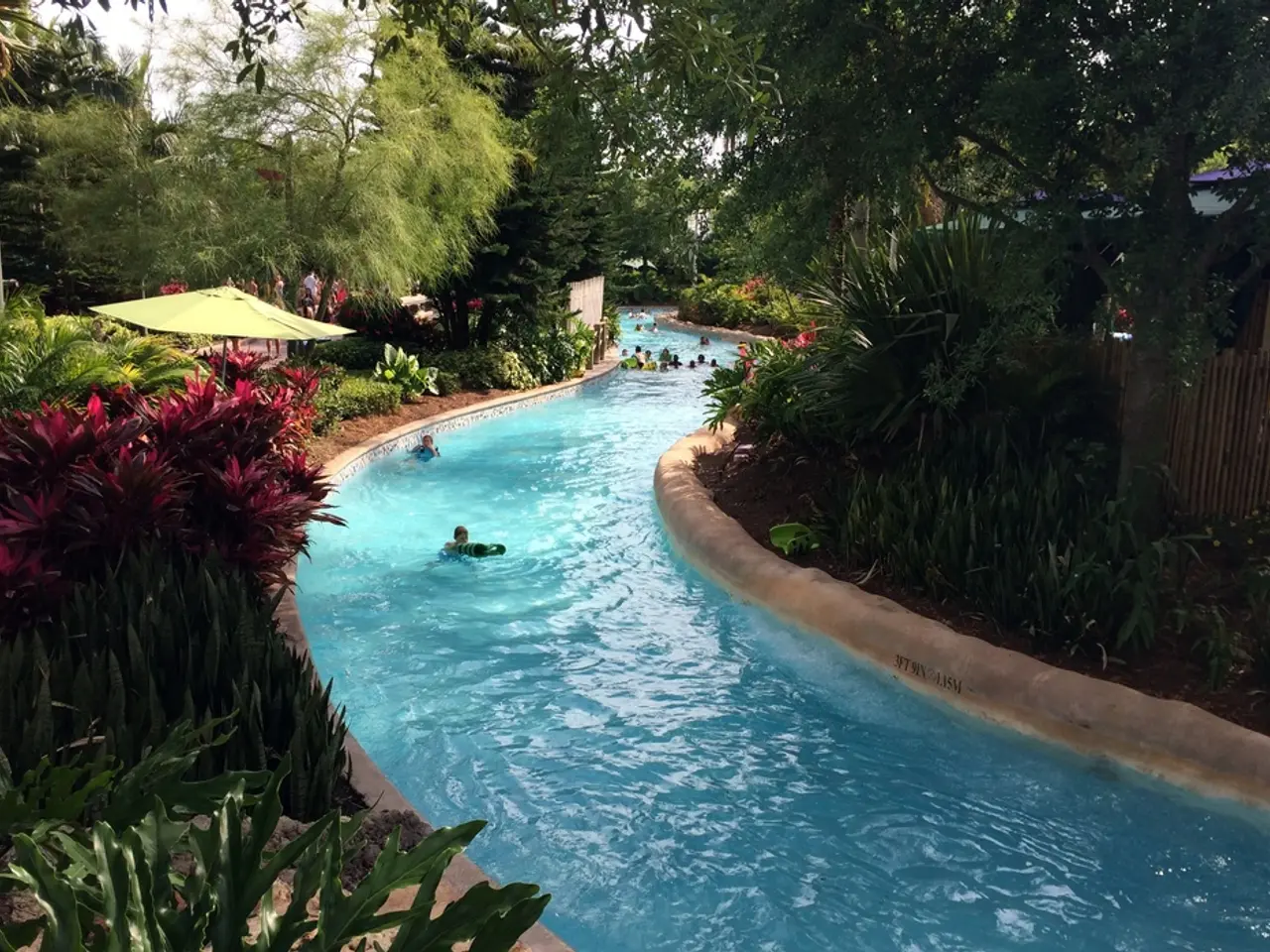 In this image in the center there is a swimming pool, and on the right side and left side there are...