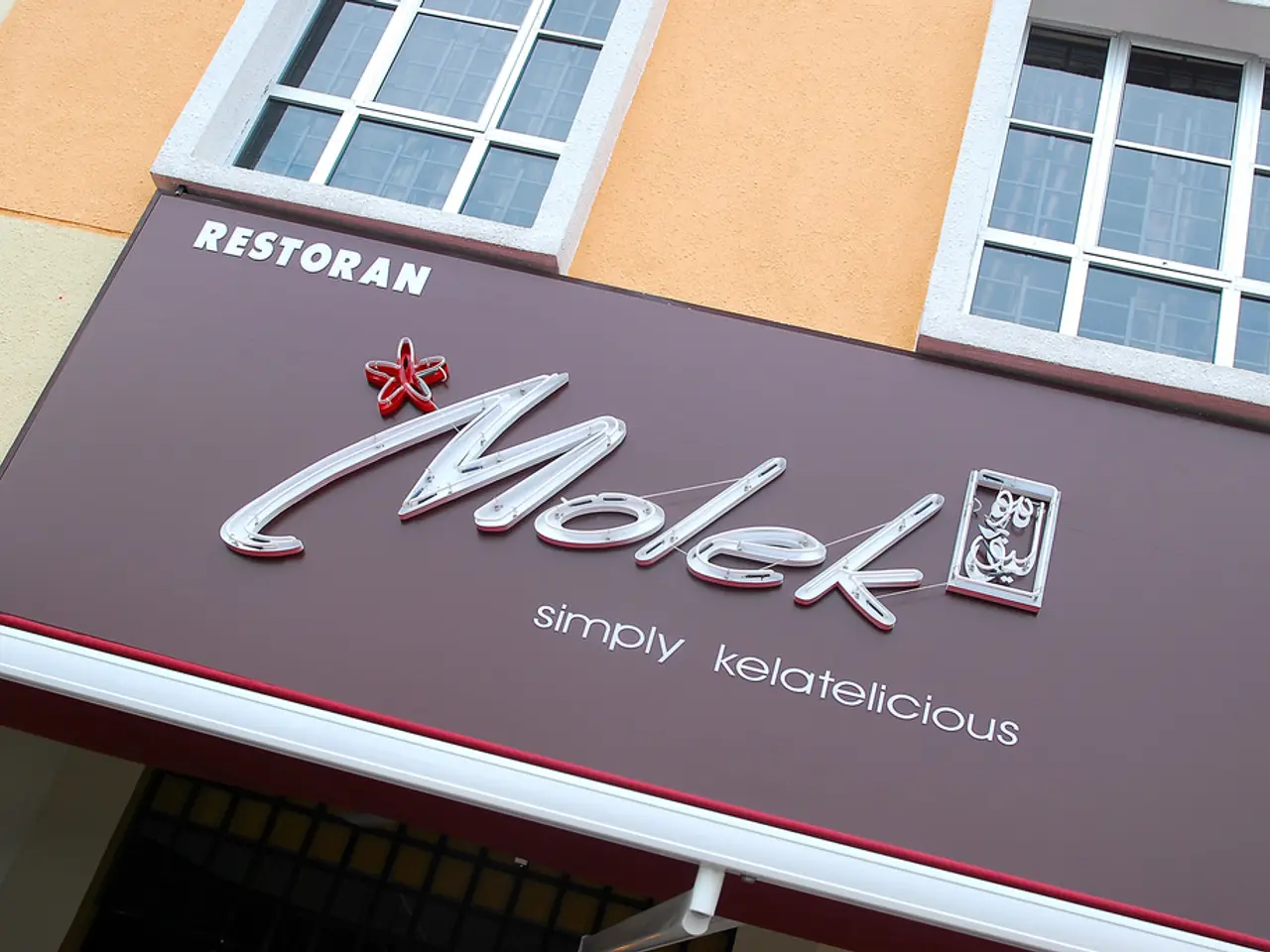 In the image we can see there is a building and there are windows on the building. There is a...