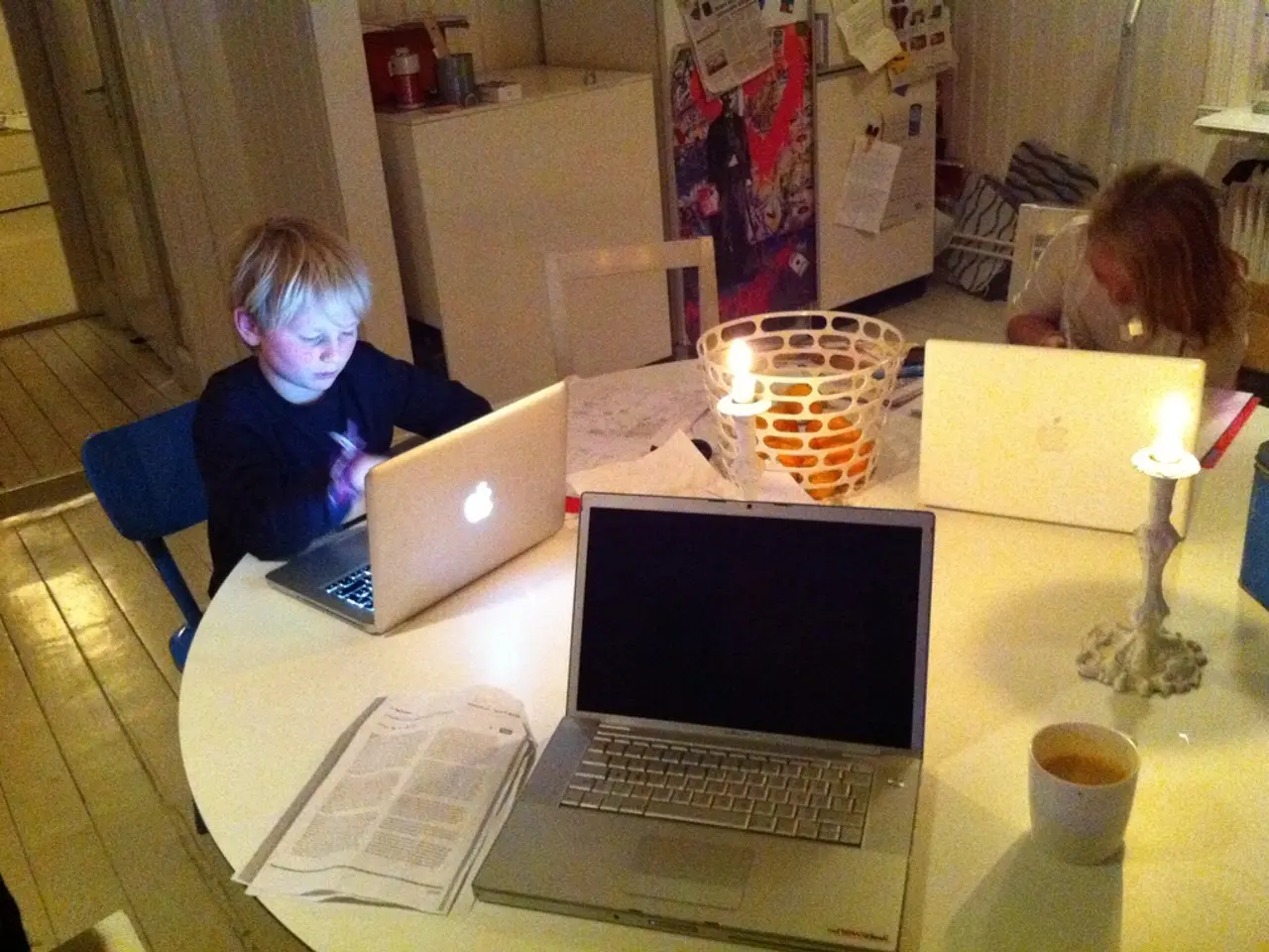 This is a picture in a home the two children are studying. This is a study table there are three...