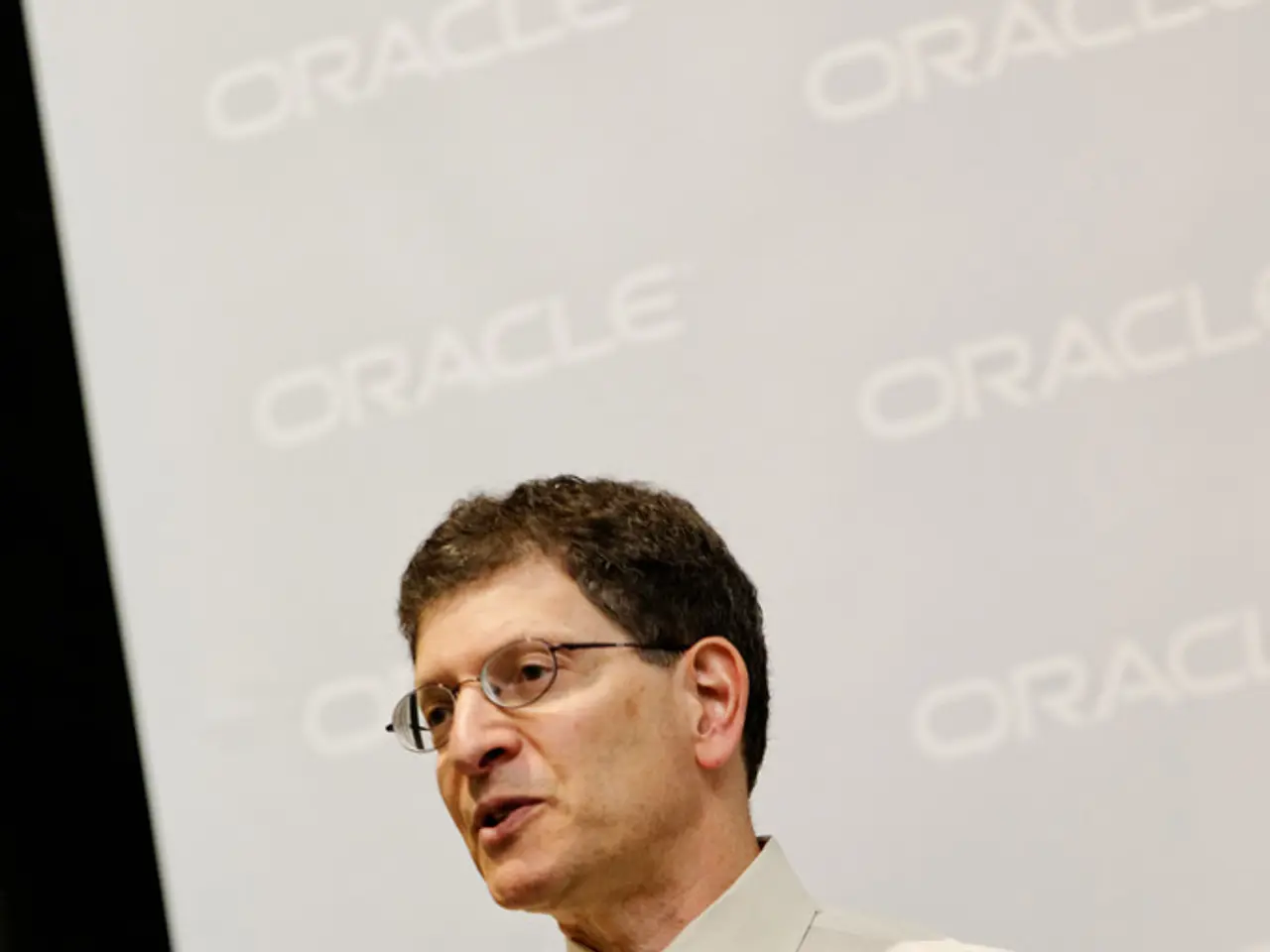 In this image, we can see a person in front of the sponsor board. This person is wearing clothes...