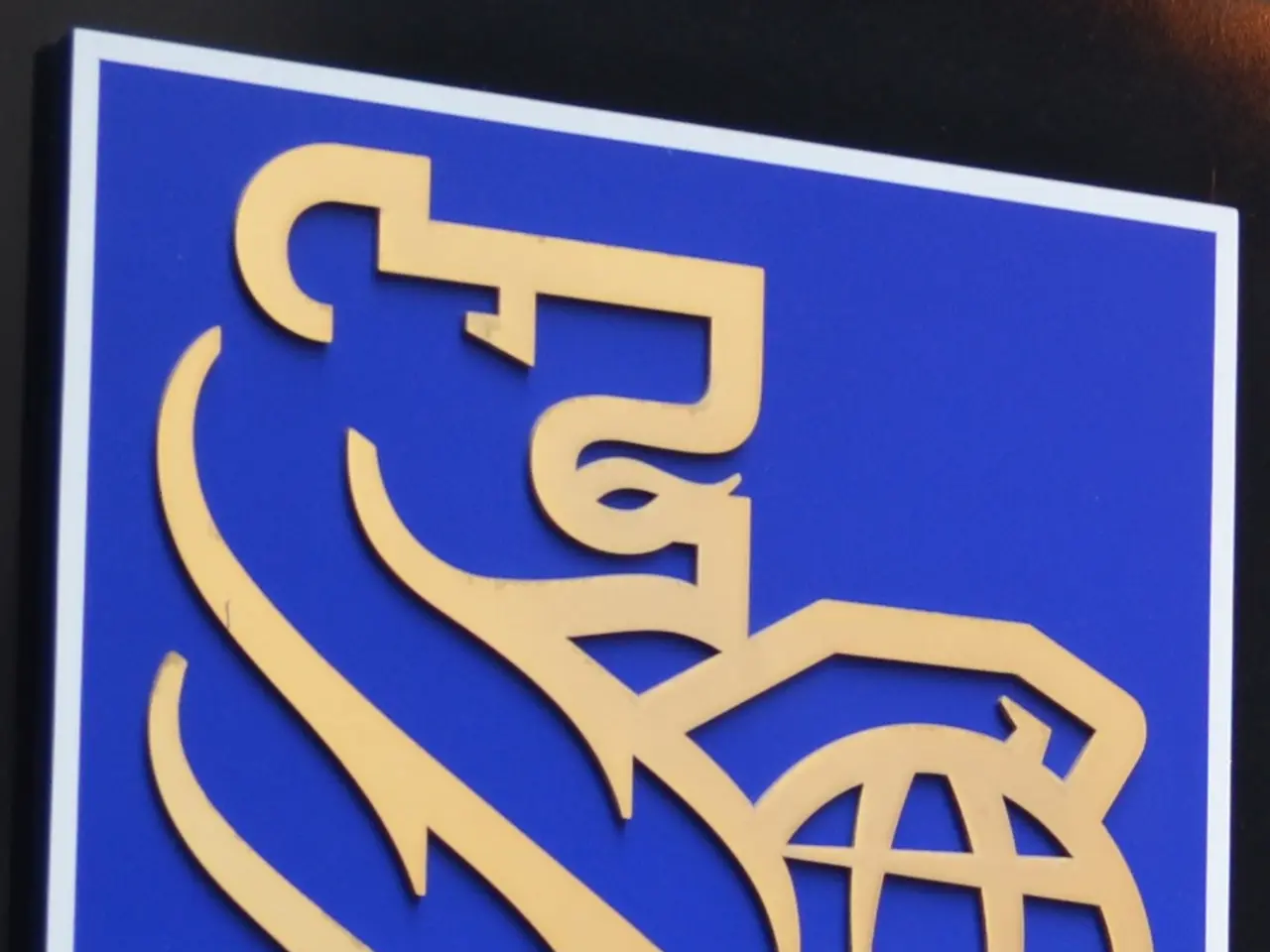The image shows the Royal Bank of Scotland (RBC) logo on a blue board against a black background.