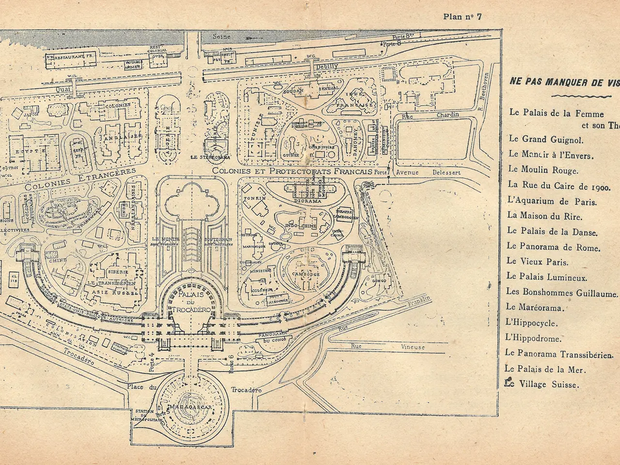 The image shows an old map of a city with a lot of buildings and text on the paper. The map is...