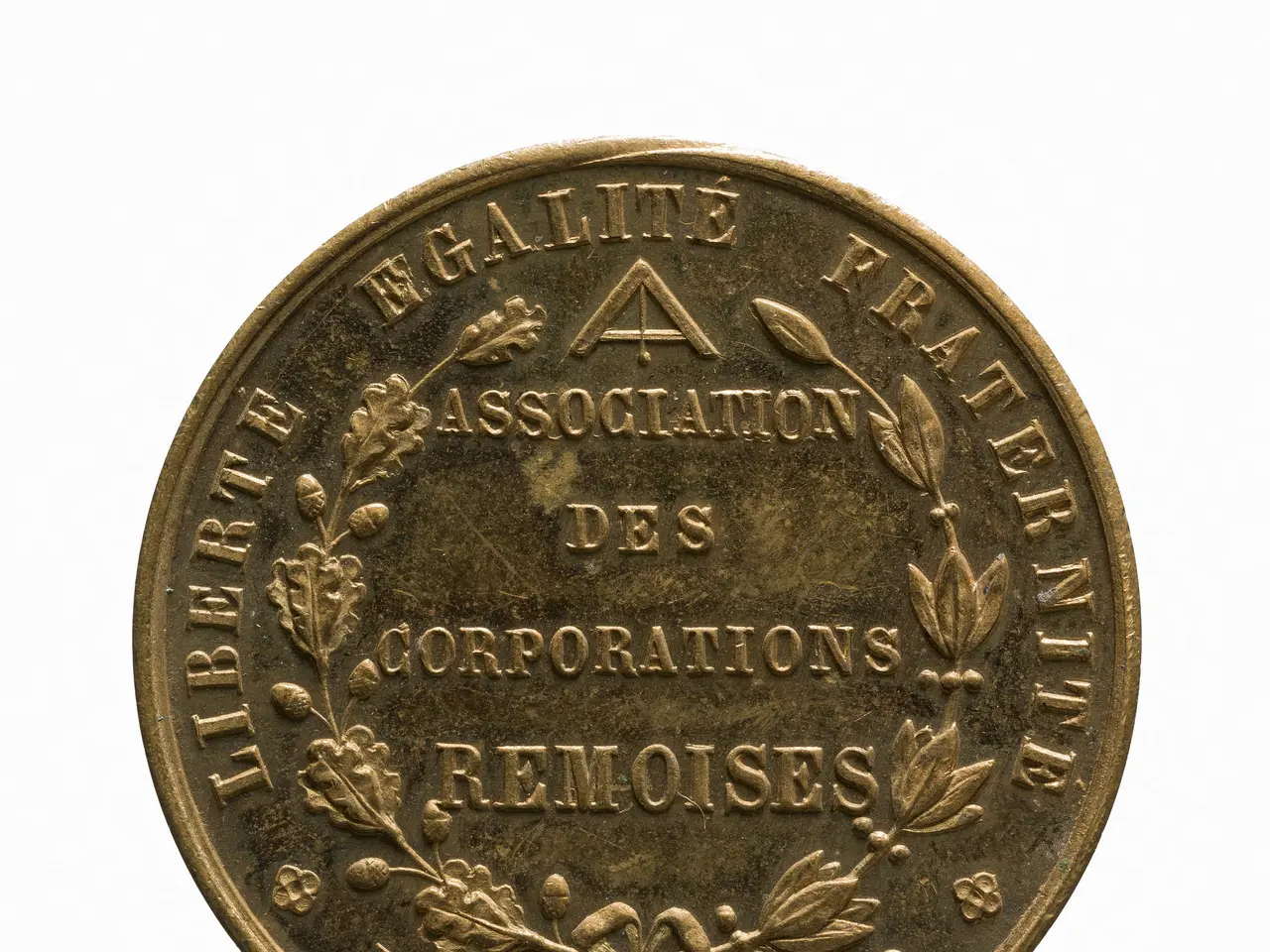 The image shows a gold medal with the words "Association des Corporations Remoises" inscribed on it...