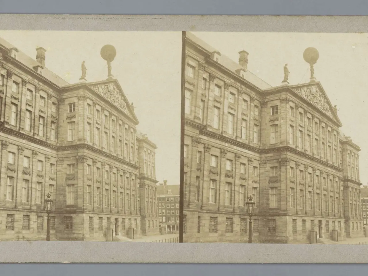The image shows an old black and white photo of a building with windows, street poles, street...