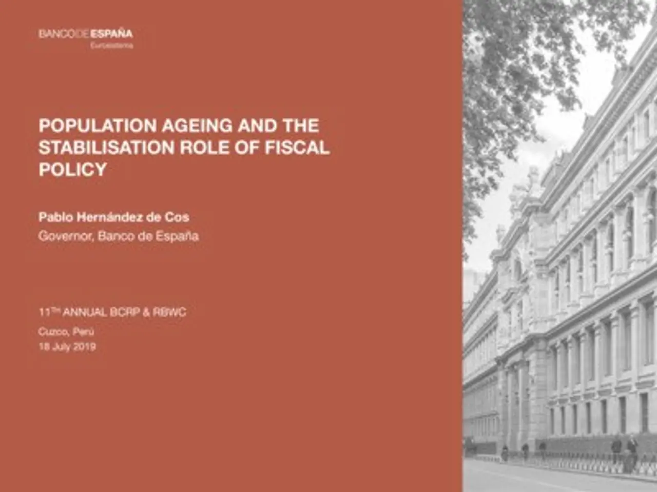 The image shows a black and white picture of a building on the right side, with a few people...