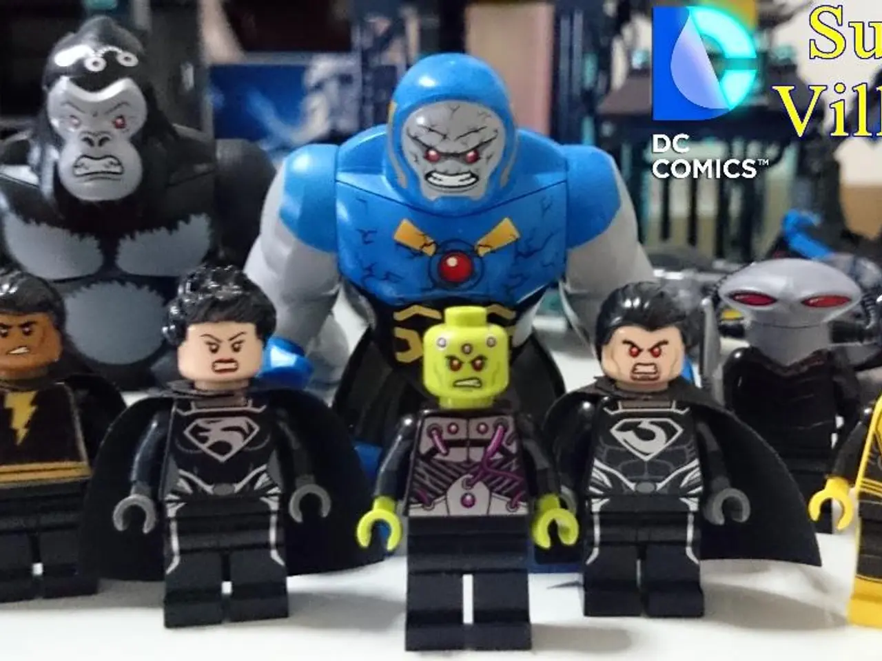 In this image I can see few toys, they are in black, yellow and blue color and the toys are on the...