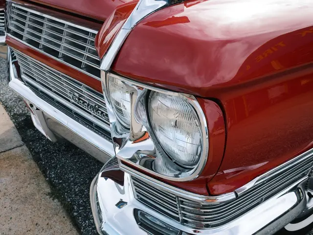 Here we can see a red color vehicle on the road.