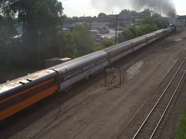 In this image there is a train on the tracks, to the right of the train there are tracks on the...