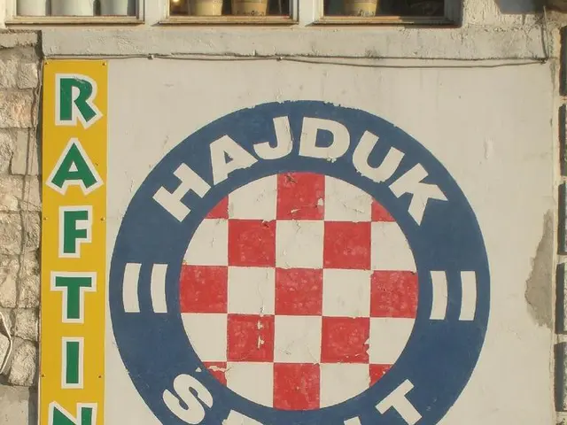 In this image we can see a poster on the wall, in the poster there are pictures on few people, they...