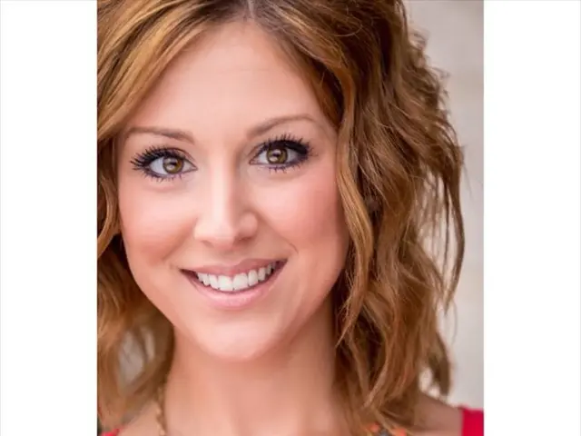 In this image I can see a woman posing for the pic wearing red dress. In the right bottom corner I...