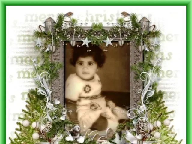 In this picture we can see a photo frame, in the frame we can find a child.