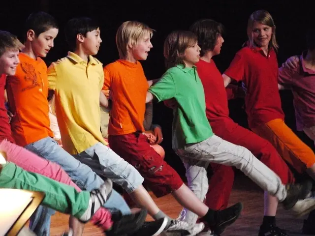 This picture seems to be clicked inside the hall. In the center we can see the group of children...