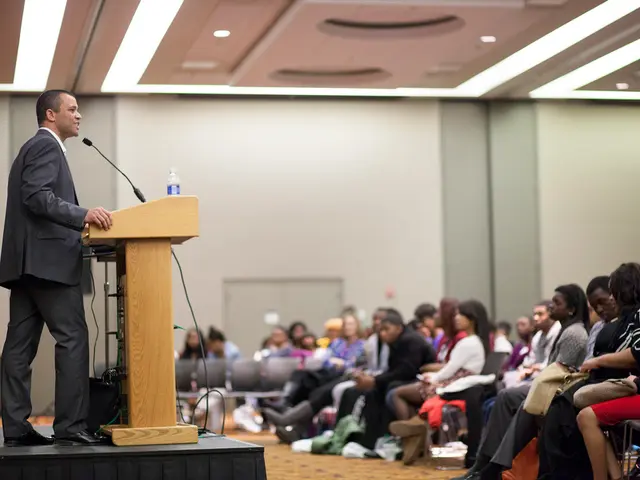 This is the picture of a place where we have some people sitting on the chairs in front of the...