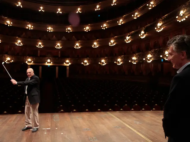 In the image there is an old man in suit holding golf bat on stage and another old man standing on...