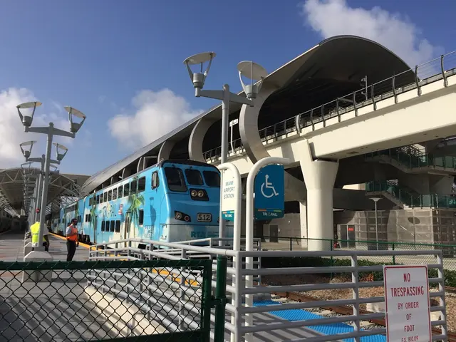 In this picture I can see there are a few people standing here at left side platform and there is a...