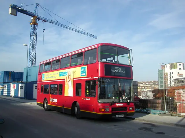 This image is taken outdoors. At the bottom of the image there is a road. At the top of the image...