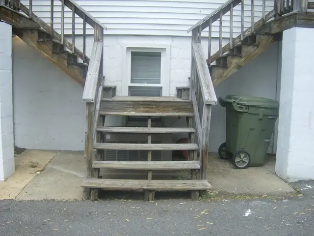 There is a road. Beside this road, there are wooden steps having wooden fences on both sides. These...