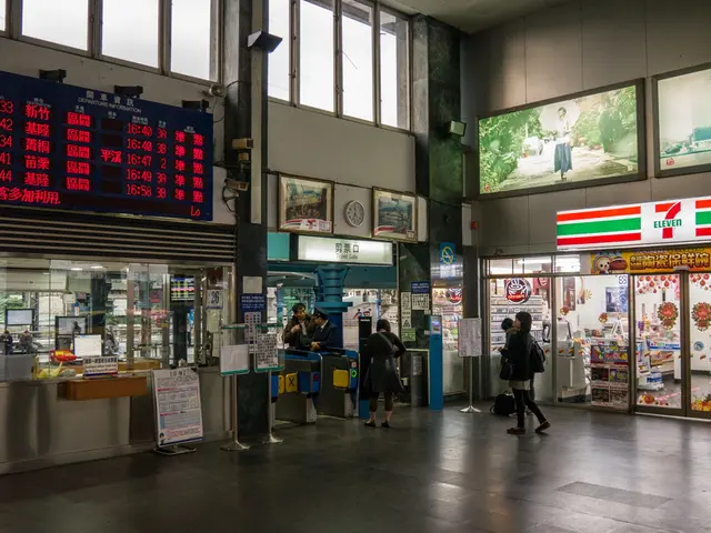 There are persons on the floor. On the left side, there is a screen which is attached to the wall....
