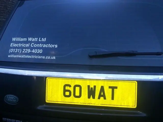 In this image we can see a car boot with some text on it and a number plate.