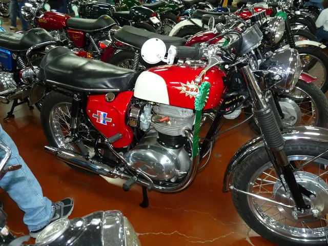 In this picture I can see many bullet bikes. In the top right corner there is a man who is wearing...