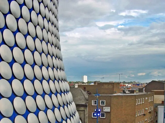 On the left there is a design on the wall,path and fence. In the background there are...