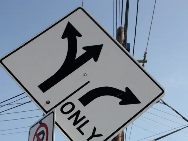 In this image, I can see a direction board, signboard and a caution board are attached to the...