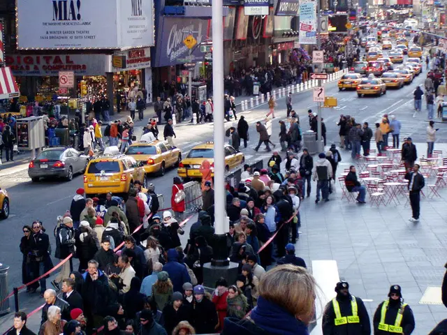 In this image there are a few vehicles passing on the road, on the either side of the road on the...