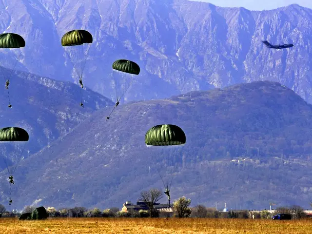 In this picture we can see the people with the paratroopers and an airplane in the air. Under the...