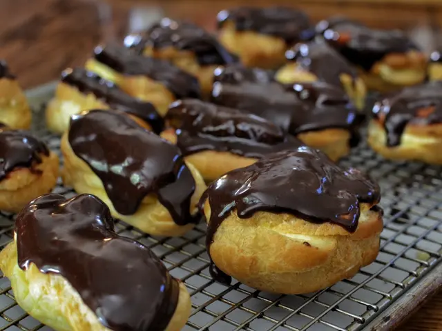 The picture consists of a cakes, on the cake there is hot chocolate sauce. At the bottom there is...