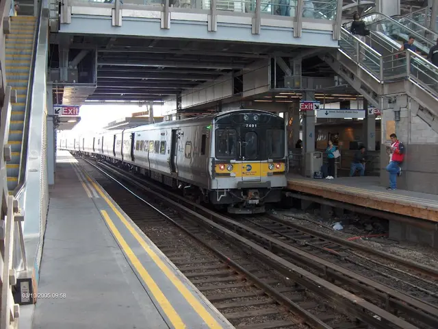 In this picture we can observe a railway station. There is a train on the railway track. We can...