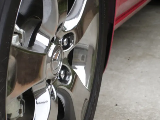 As we can see in the image there is a red color car.