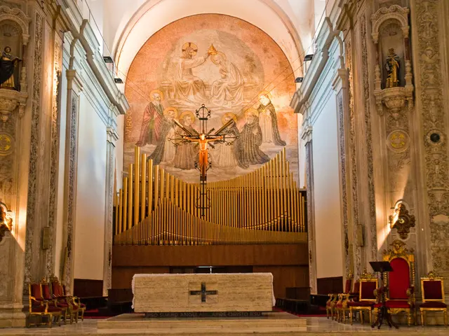 It is the inside of a church, in the middle there is the statue of Jesus Christ. On the right side...