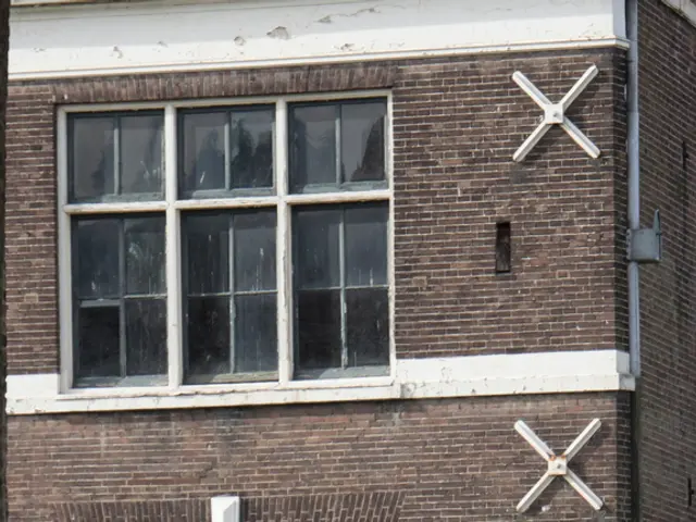 This is a picture of a building with windows and pipes.