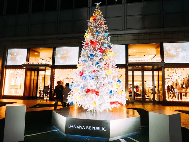Here we can see a tree with gifts tied to it on a platform. In the background there is a...