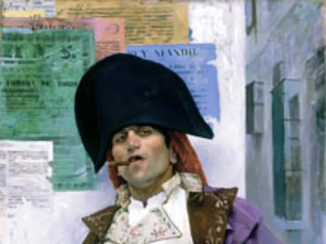 In this picture I can see a man in front, who is wearing a costume. In the background I see the...