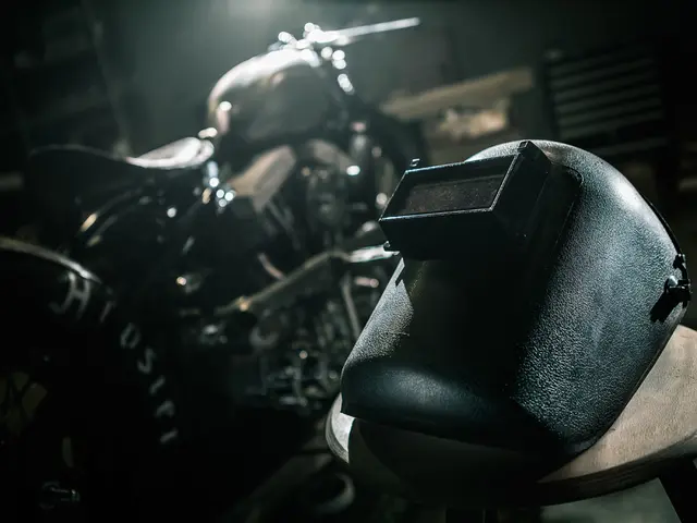 In this picture I can see a mask on the right side, there is a motorcycle on the left side.