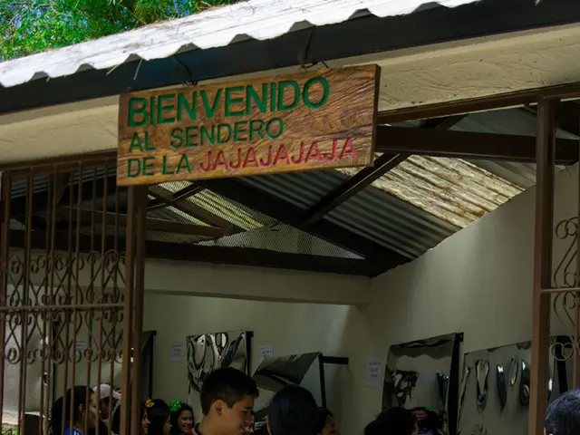 In this image there are people in a shop, the shop is covered with iron sheet, on the top there is...