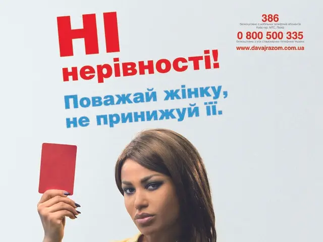 In this image a lady wearing yellow t-shirt is standing. She is holding a red card. On the top...