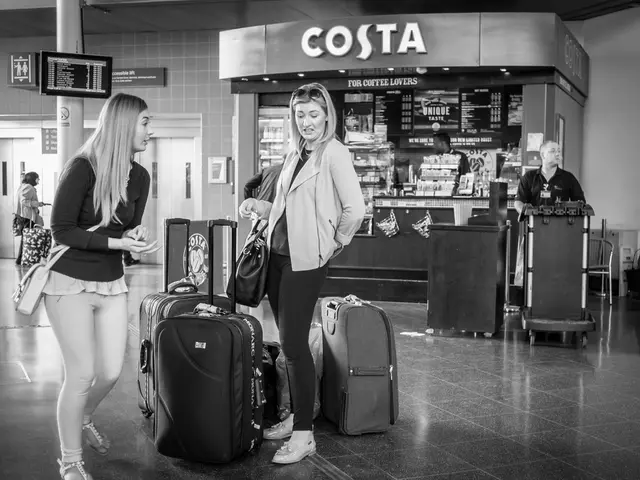 In the image there are two woman and in front of them there are luggage bags and back side there is...