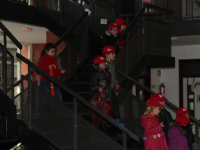 This image is taken indoors. In the background there are few walls. There are few staircases and...