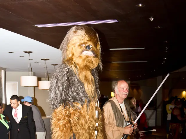 This image consists of many persons. In the front, the person is wearing a costume. At the bottom,...