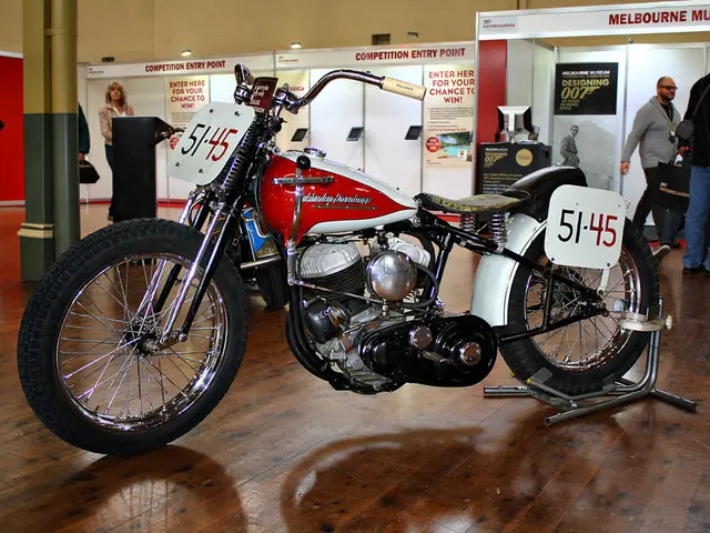 It is a bike which is in white and red color. On the right side 2 men are there and here a man is...