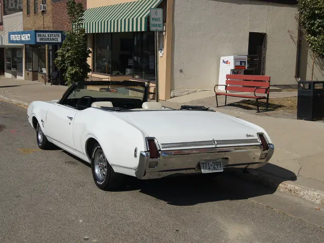 a car is present on the road, which is white in color and its number is 771-299. to its right there...