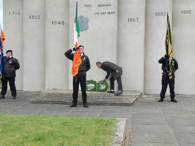 In this picture, we see three people in the uniform are standing. They are holding the flags which...